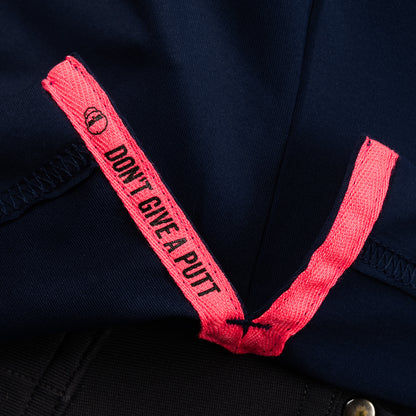 Interior detail of SWAG Golf Navy Aces Classic Polo featuring signature Don't Give A Putt embroidery tape.