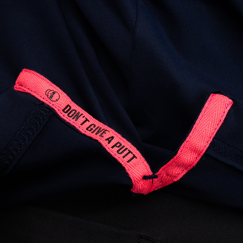 Interior detail of SWAG Golf Navy Flipper Classic Polo featuring signature Don't Give A Putt text