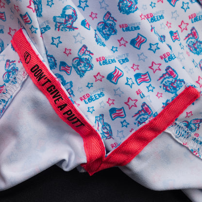 Interior detail of SWAG Golf Red, White & Beers Classic Polo featuring signature Don't Give A Putt embroidery tape in bold red accent color