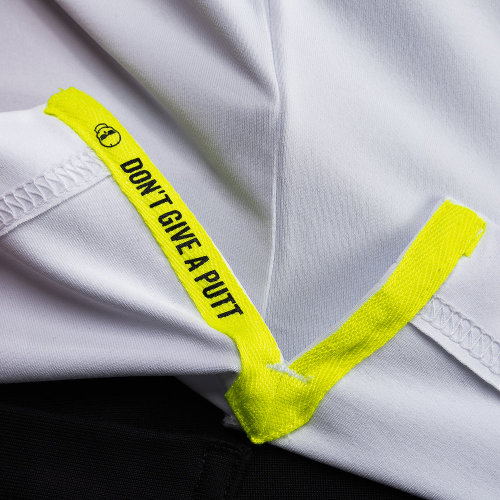 Interior detail of SWAG Golf White King Classic Polo featuring signature Don't Give A Putt text