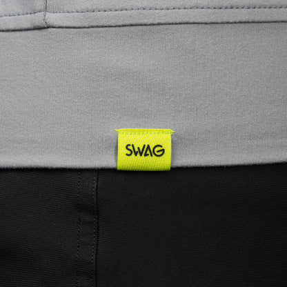 SWAG Golf Gray Club Quarter-Zip hem detail with signature SWAG woven tag on performance golf pullover