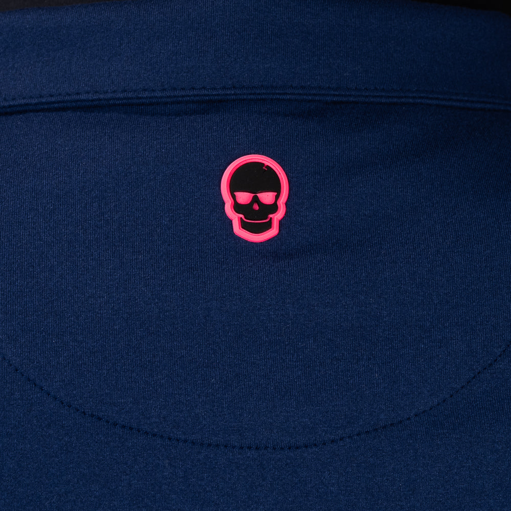 Close-up of embroidered SWAG Golf skull logo on Navy Club Quarter-Zip performance golf pullover
