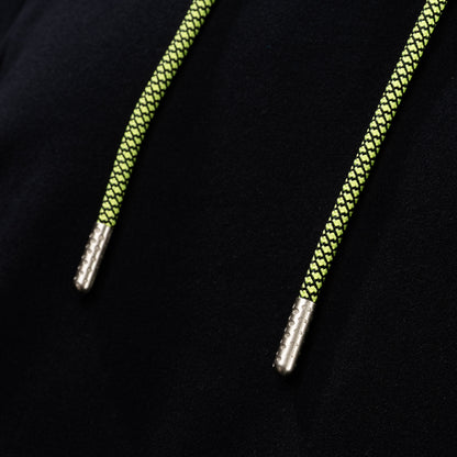 Close-up of neon braided drawstrings with metal tips on the SWAG Golf Black Lounge Hoodie