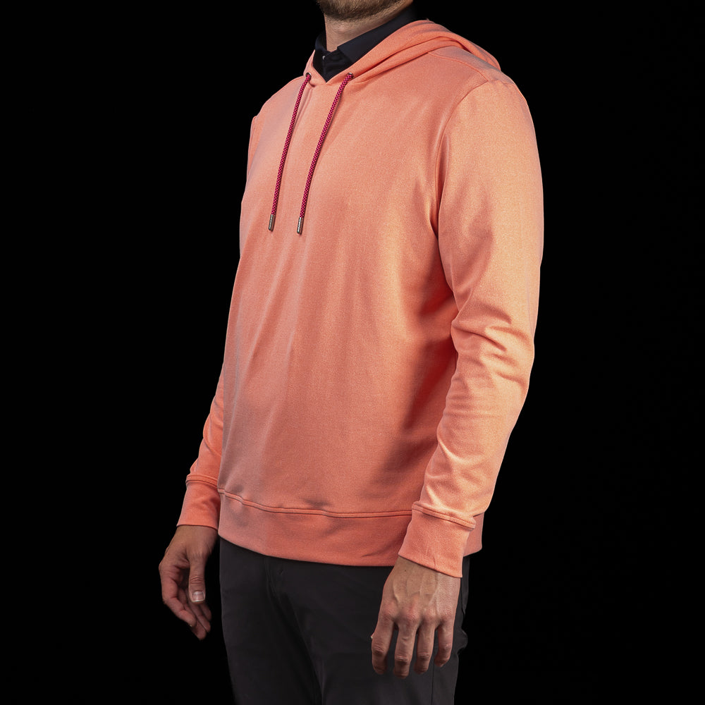 Side profile of SWAG Golf Heathered Peach Lounge Hoodie highlighting the modern fit, hood construction, and heathered fabric