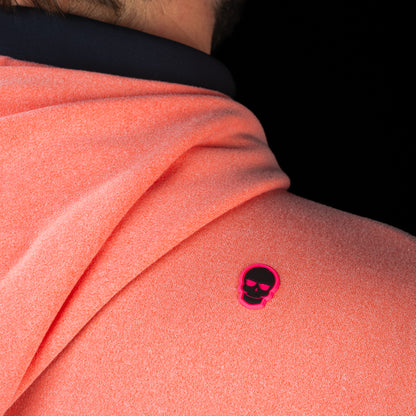 Back shoulder detail of SWAG Golf Heathered Peach Lounge Hoodie featuring the signature pink skull logo