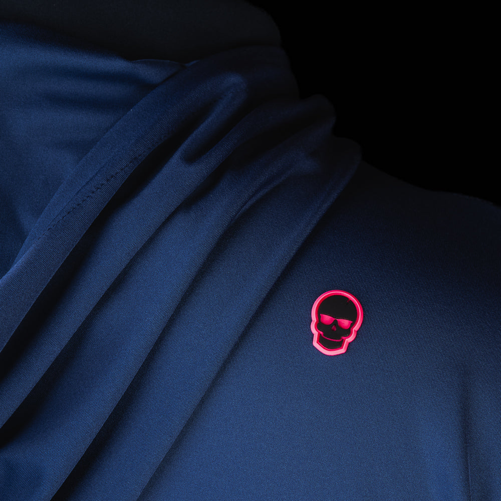 Close-up of embroidered SWAG Golf skull logo on Navy Player Hoodie performance golf hoodie