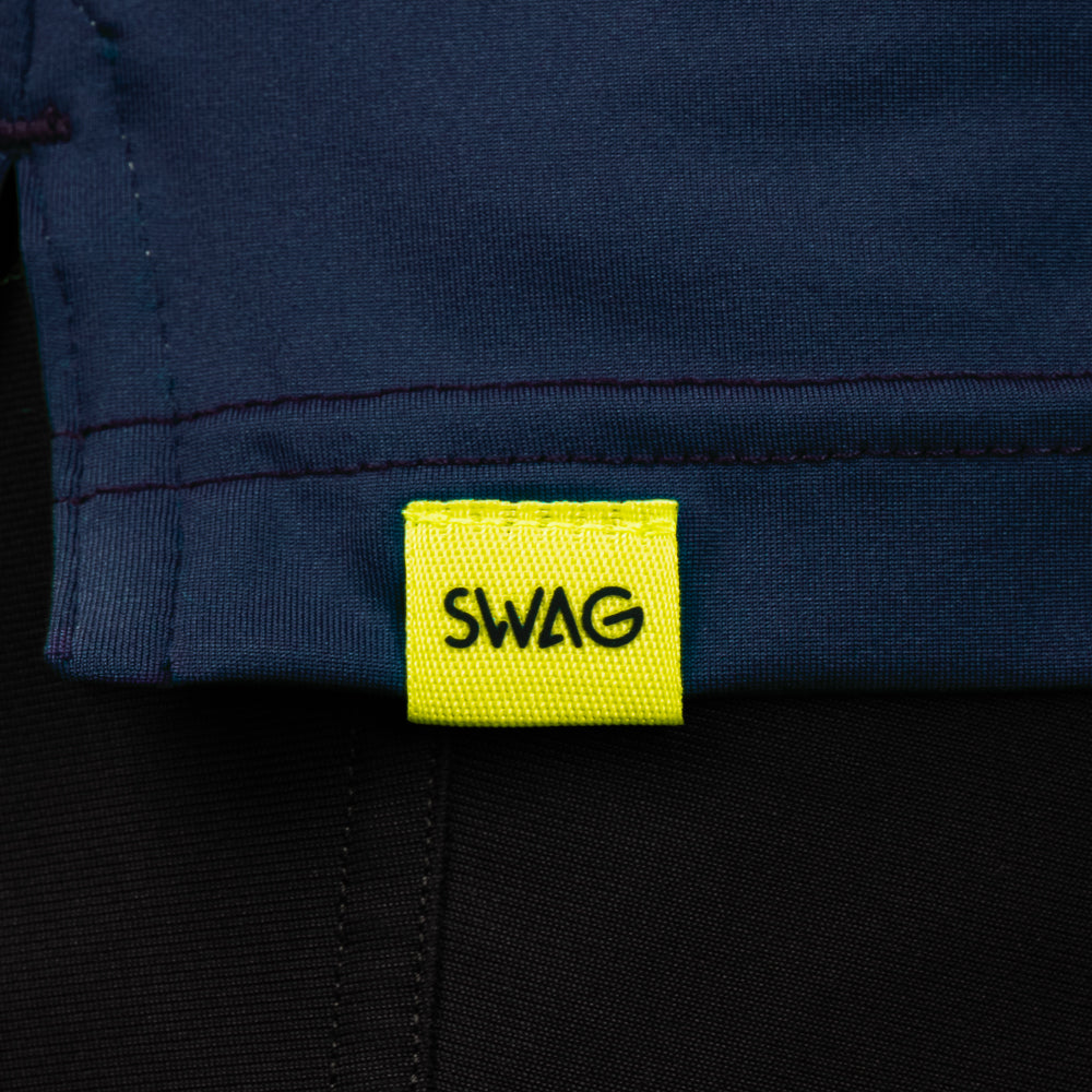 SWAG Golf Navy Player Hoodie hem detail with signature SWAG woven tag on performance golf hoodie