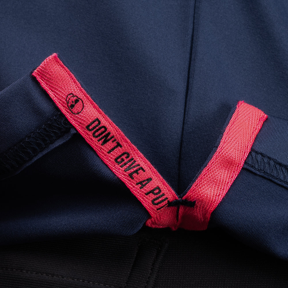 Interior detail of SWAG Golf Navy Player Hoodie featuring signature Don't Give A Putt embroidery tape