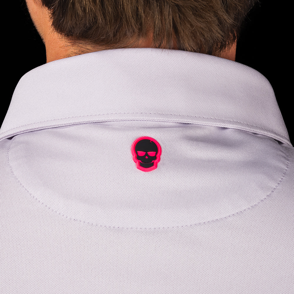 SWAG Golf Lavender Script Tech Polo back collar detail featuring the signature pink skull logo embroidered beneath the collar.