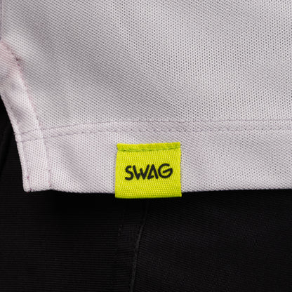SWAG Golf Lavender Script Tech Polo hem detail featuring the signature neon SWAG woven tag.