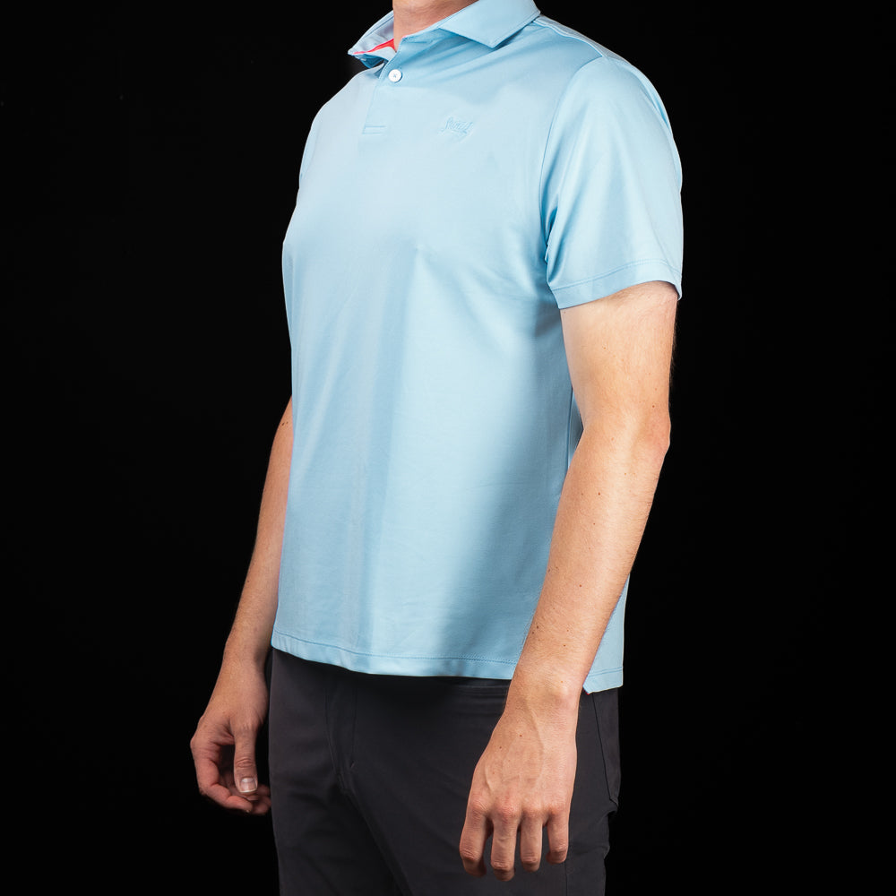 Side profile of SWAG Golf Sky Blue Script Tech Polo showcasing the modern athletic fit, breathable stretch fabric, and clean silhouette.