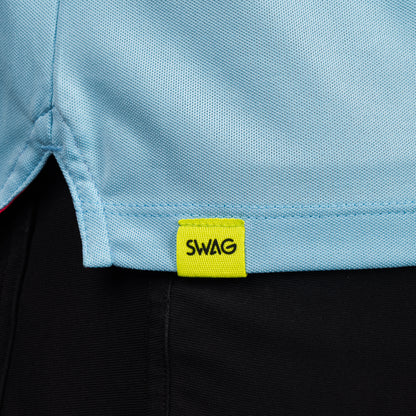 SWAG Golf Sky Blue Script Tech Polo hem detail featuring the signature neon SWAG woven tag.