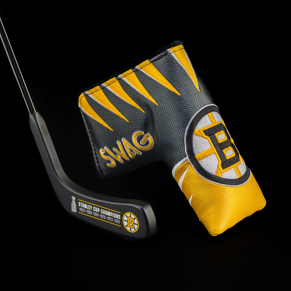 SWAG Boston Bruins hockey stick blade putter with Bruins jersey cover in black and gold