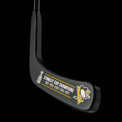 Bold Pittsburgh Penguins logo on Hockey Blade Putter head inscribed Stanley Cup Champions 1991, 1992, 2009, 2016, 2017.