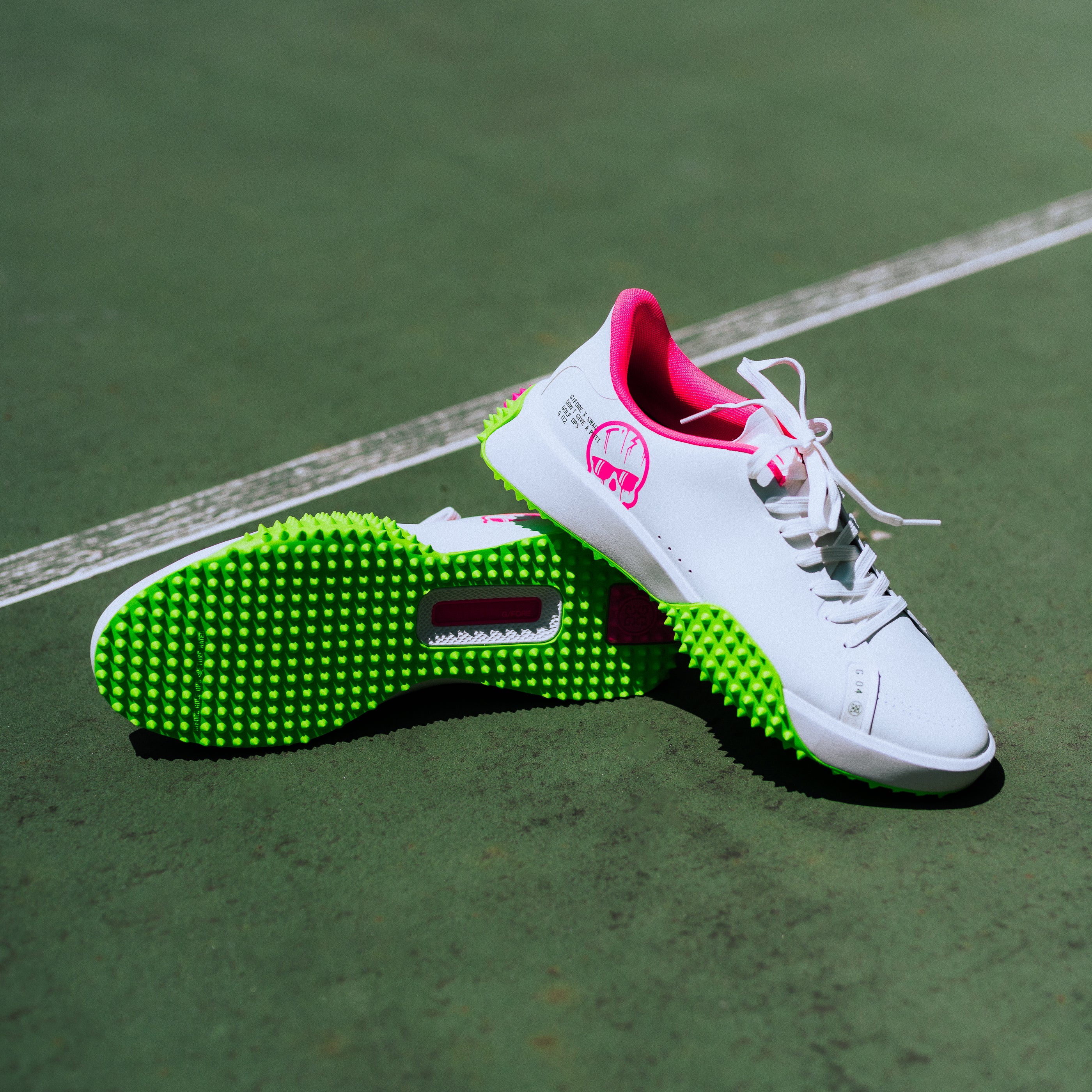 Swag x G/Fore G.112 Swagenta Skull men's white, pink, and green golf shoe.