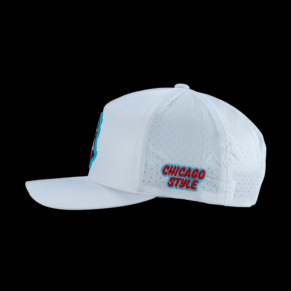 White performance golf hat with a Chicago style hot dog patch and 'Chicago Style' text on the side.