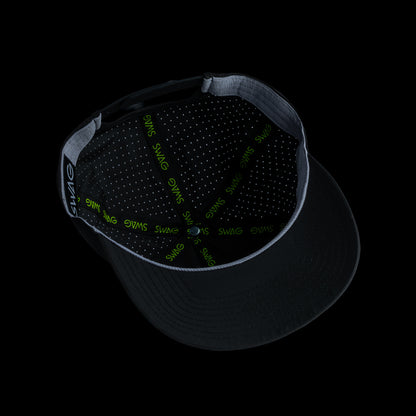 Black performance golf hat with a colorful bourbon glass skull graphic rubber patch on a black background