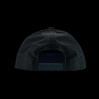 Black performance golf hat with a colorful bourbon glass skull graphic rubber patch on a black background