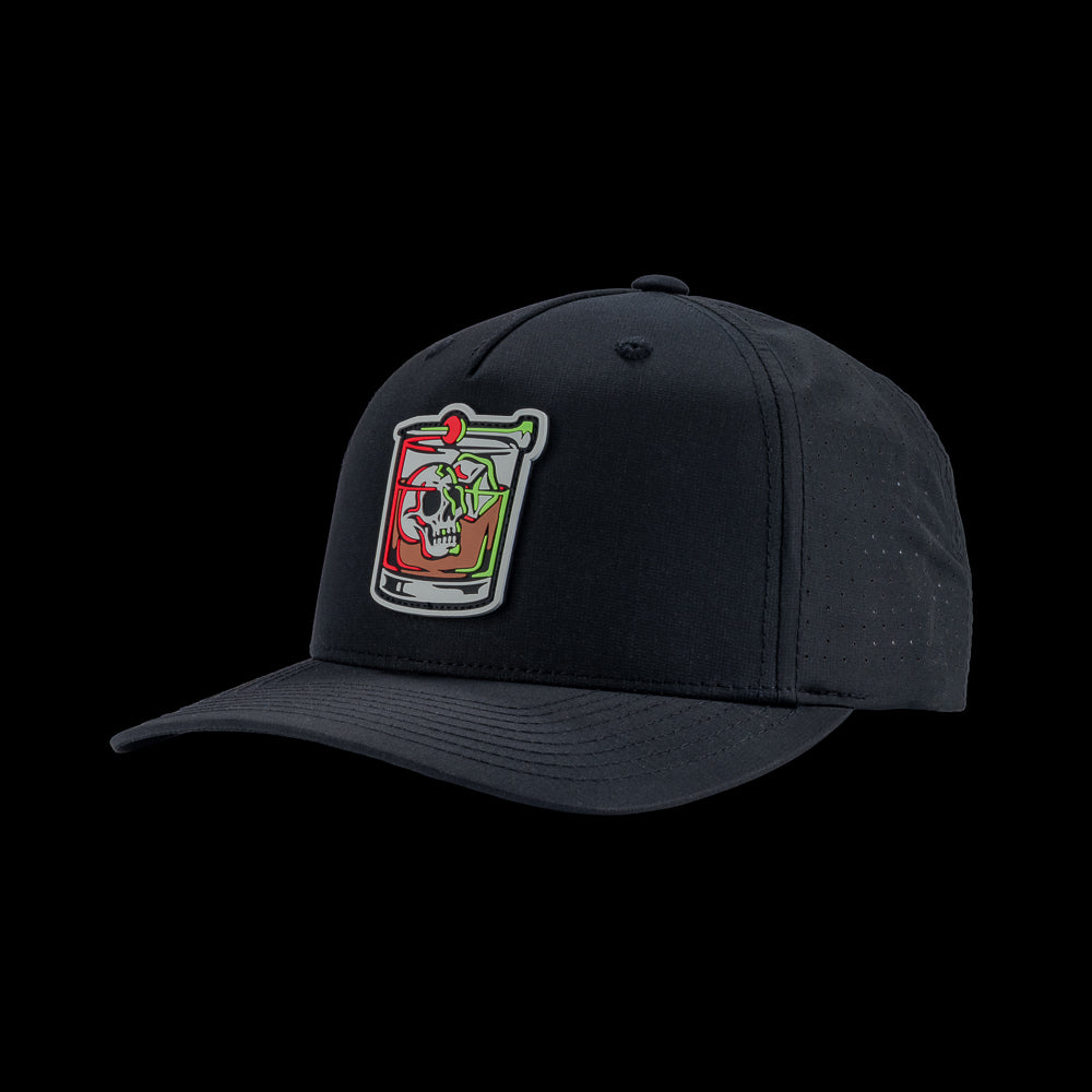 Black performance golf hat with a colorful bourbon glass skull graphic rubber patch on a black background