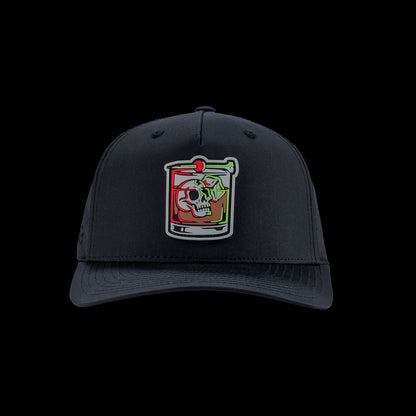 Black performance golf hat with a colorful bourbon glass skull graphic rubber patch on a black background
