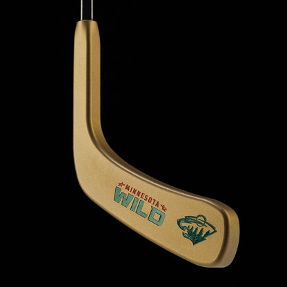 SWAG X NHL hockey stick putter head gold inscribed with Minnesota Wild and Wild logo.