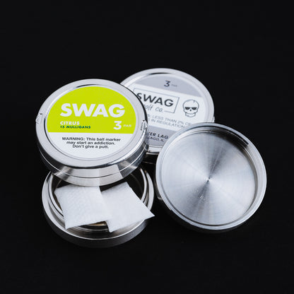 Stainless Steel ball marker tins with green label.