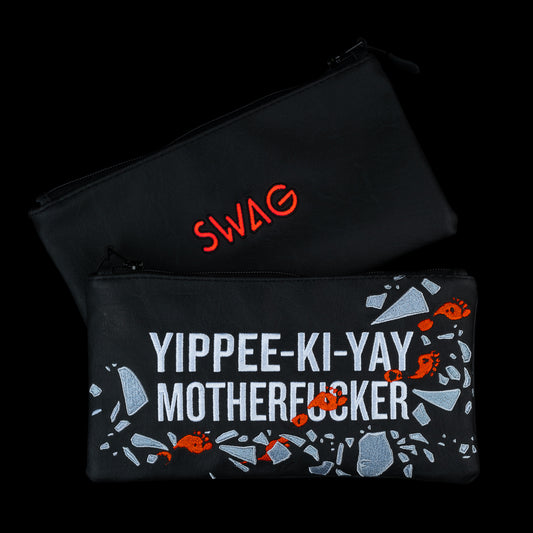 Swag Golf Yippee Ki-Yay movie themed black, white, and red zippered vinyl valuables pouch accessory.