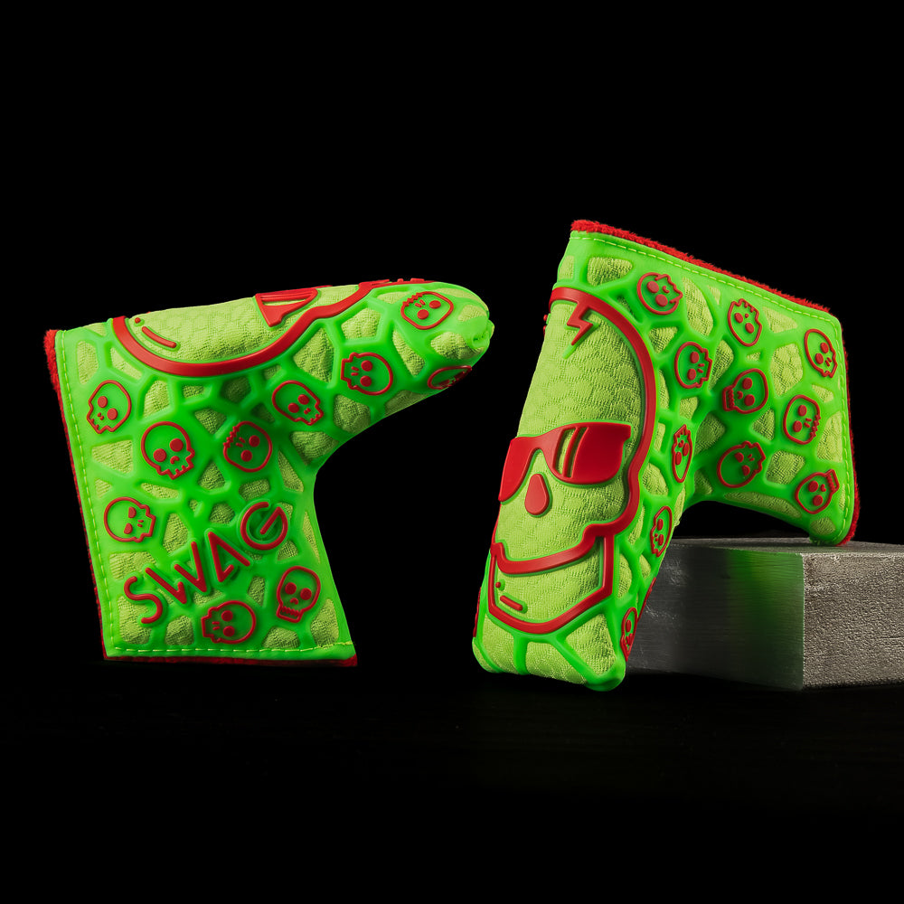 Green and red tpu skull blade golf headcover on a black background