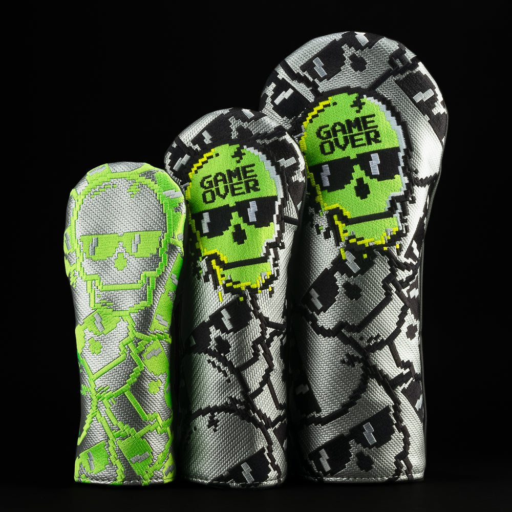 SWAG Golf Game Over stacked skull black, gray, and neon green golf headcover set that includes a driver, fairway, and hybrid.