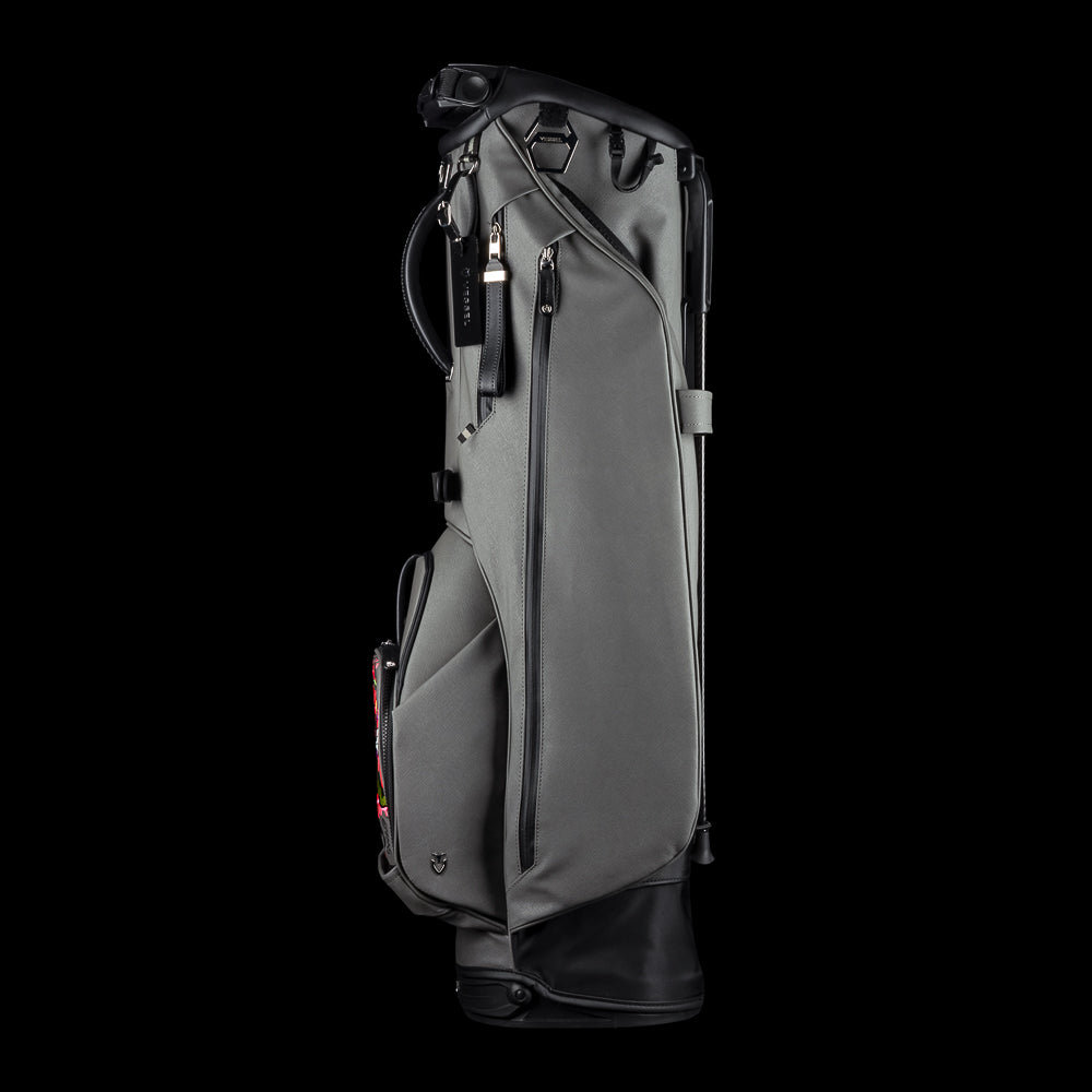 SWAG x Vessel VLS Lux grey golf stand bag with a Defaced Joker embroidered ball pocket panel.