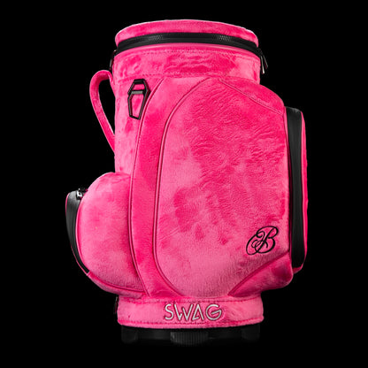 Side view of pink plush SWAG Golf den caddy cooler featuring SWAG logo embroidery and multiple storage pockets.