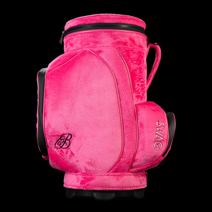 Side profile of pink plush SWAG Golf den caddy cooler showing large storage panel and embroidered script B logo.