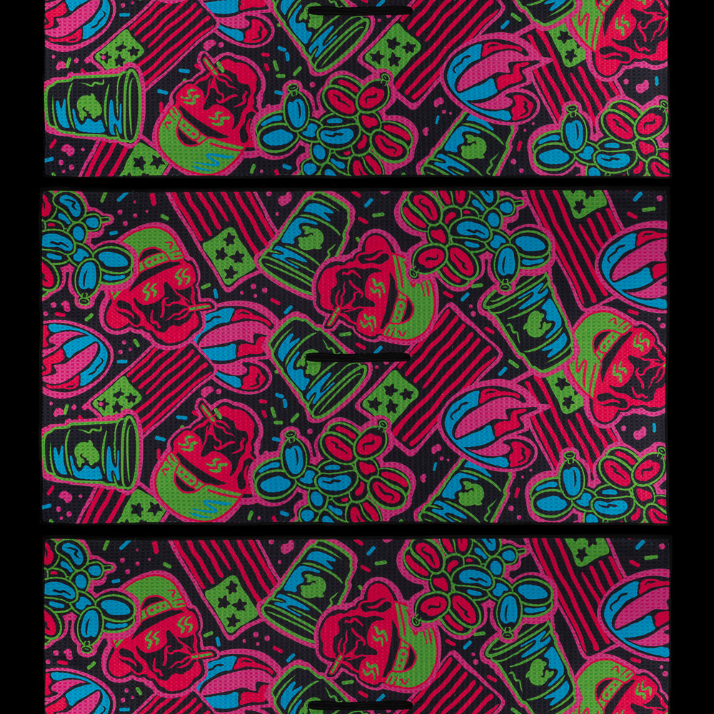 SWAG Golf towel with an all-over neon holiday cookie pattern featuring skulls, stars, and iced designs in red, green, blue, and pink.