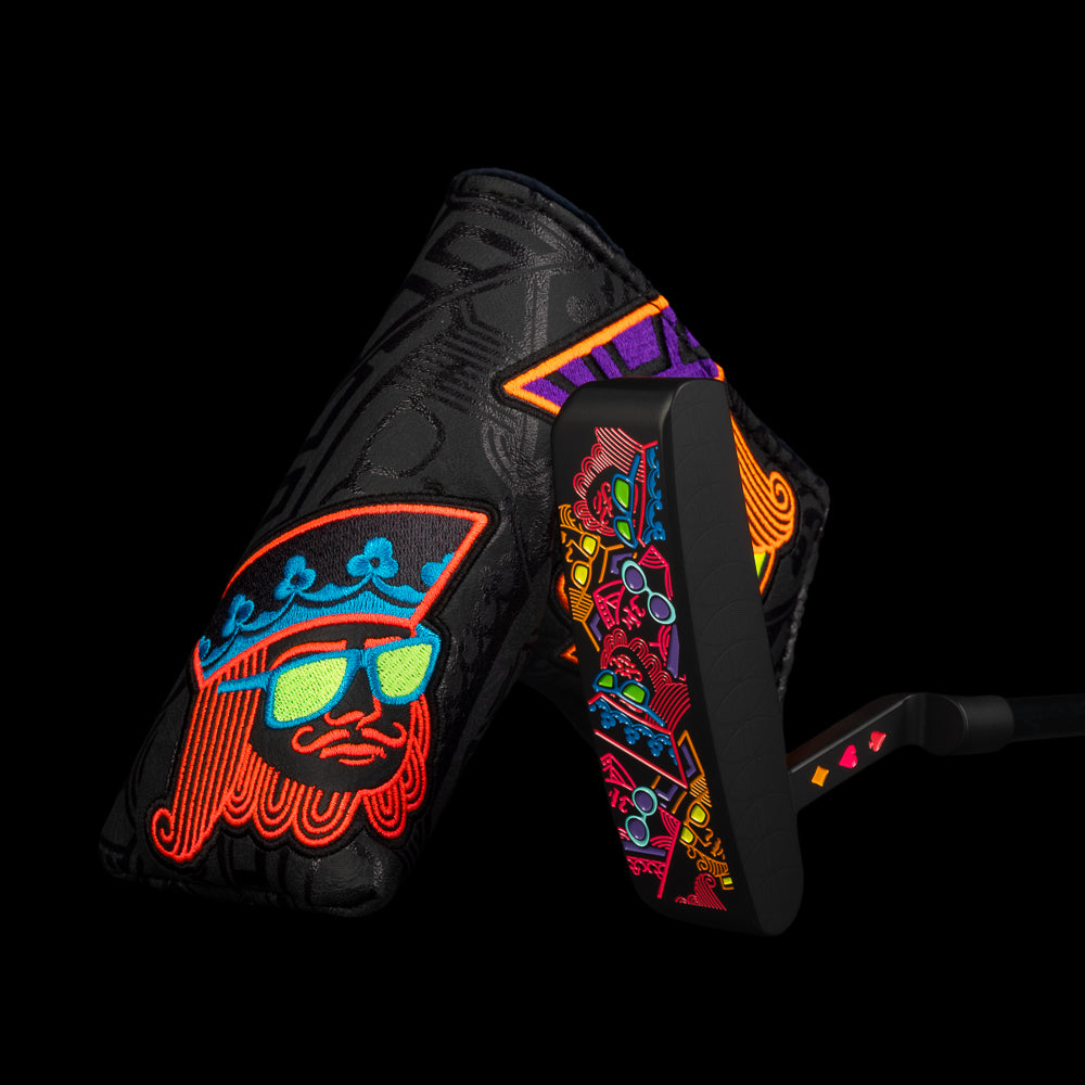 SWAG Golf Sherbet stacked royalty black cerakote finish limited edition right handed golf putter with handpainted neon orange, purple, red, and orange accents. Includes a headcover.