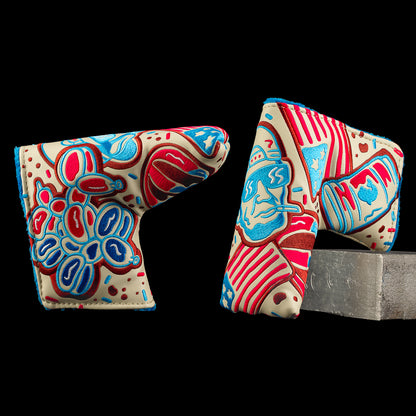 Holiday cookie-themed SWAG Golf blade putter headcovers with red, blue, and teal designs.