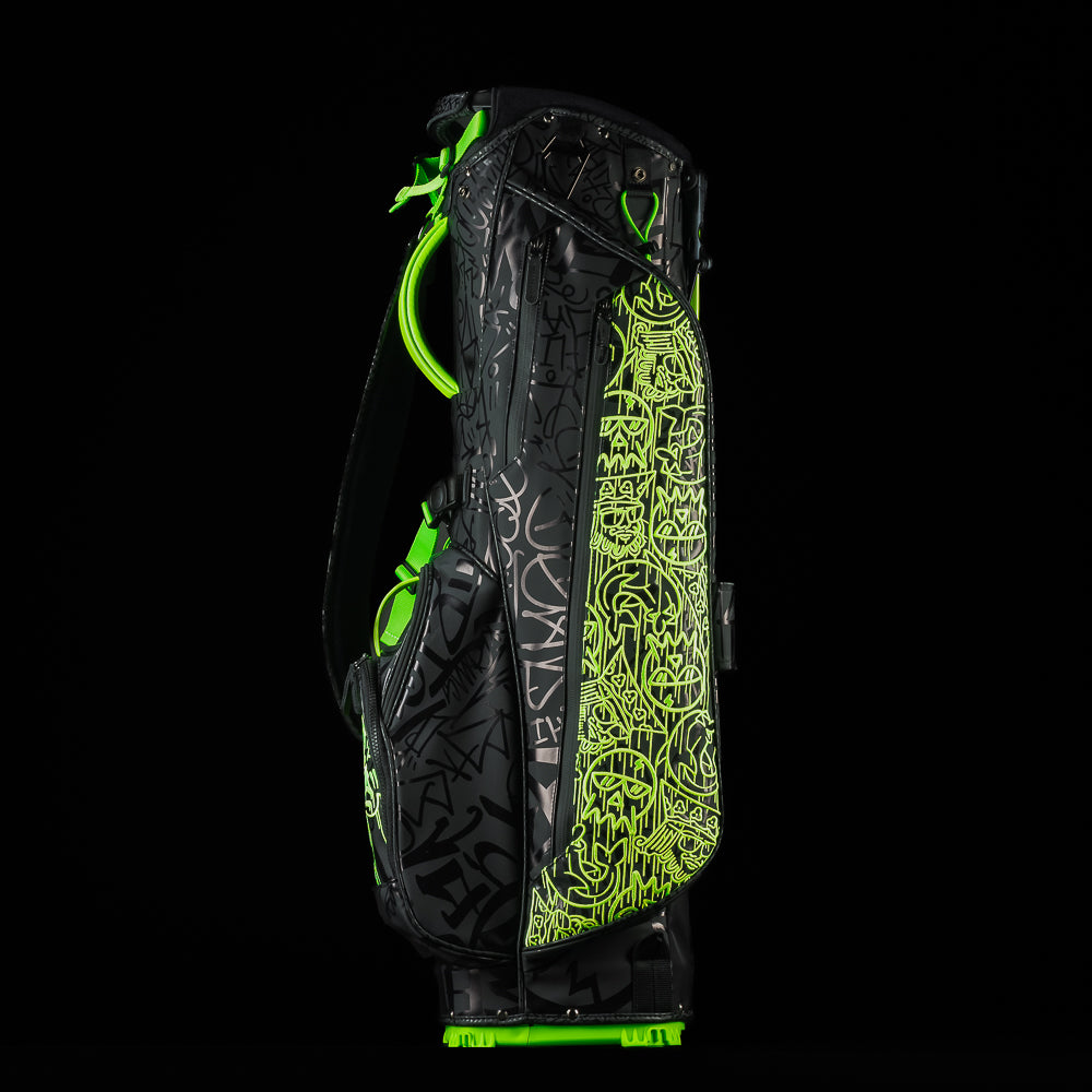 SWAG Golf fully tagged black and neon green stand bag bundle set that includes at stand bag, 3-piece headcover set, towel, and putting disc.