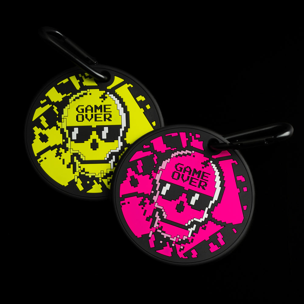 SWAG Golf Game Over stacked skulls black, neon pink, and yellow golf putting disc training aid.