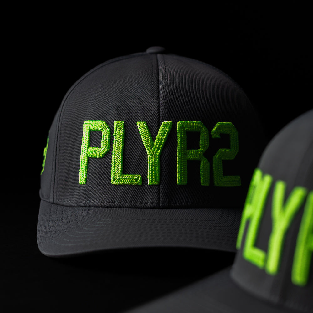 G/Fore x SWAG Golf black and neon green PLYR2 flexfit 110 golf hat.