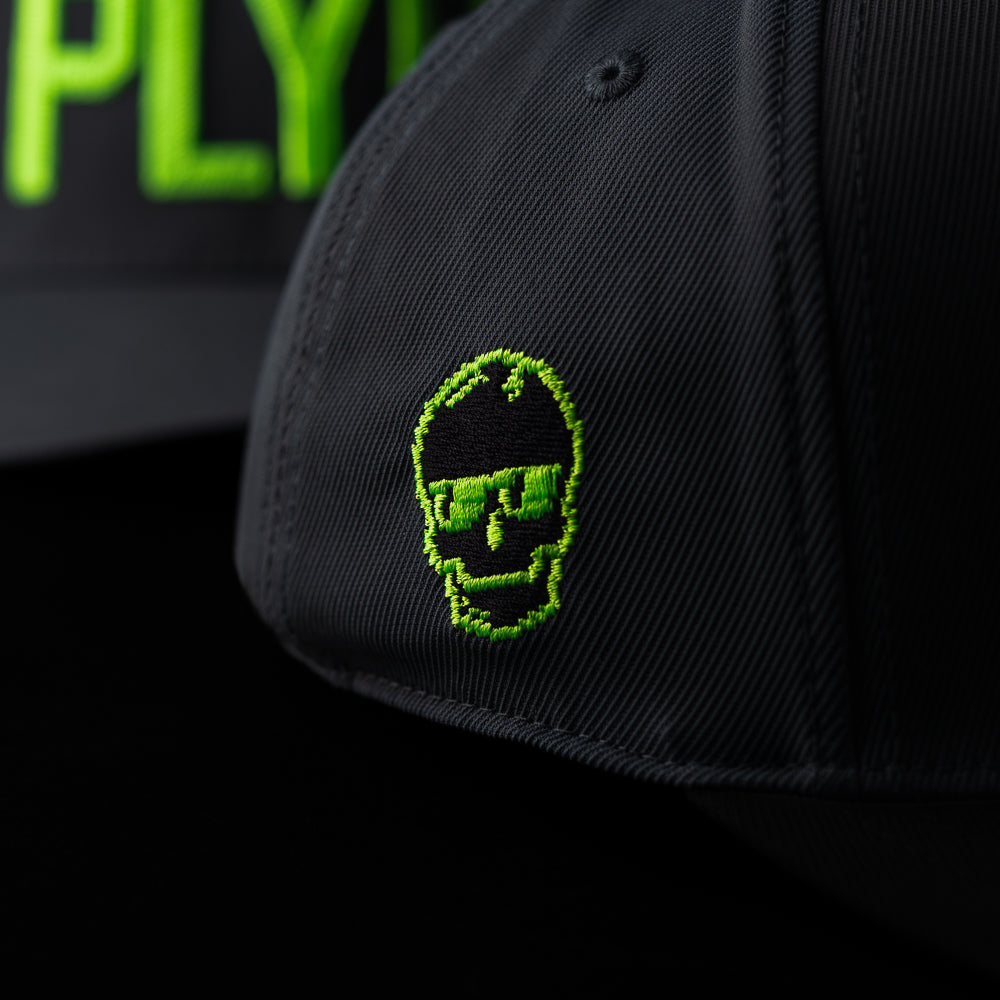 G/Fore x SWAG Golf black and neon green PLYR2 flexfit 110 golf hat.