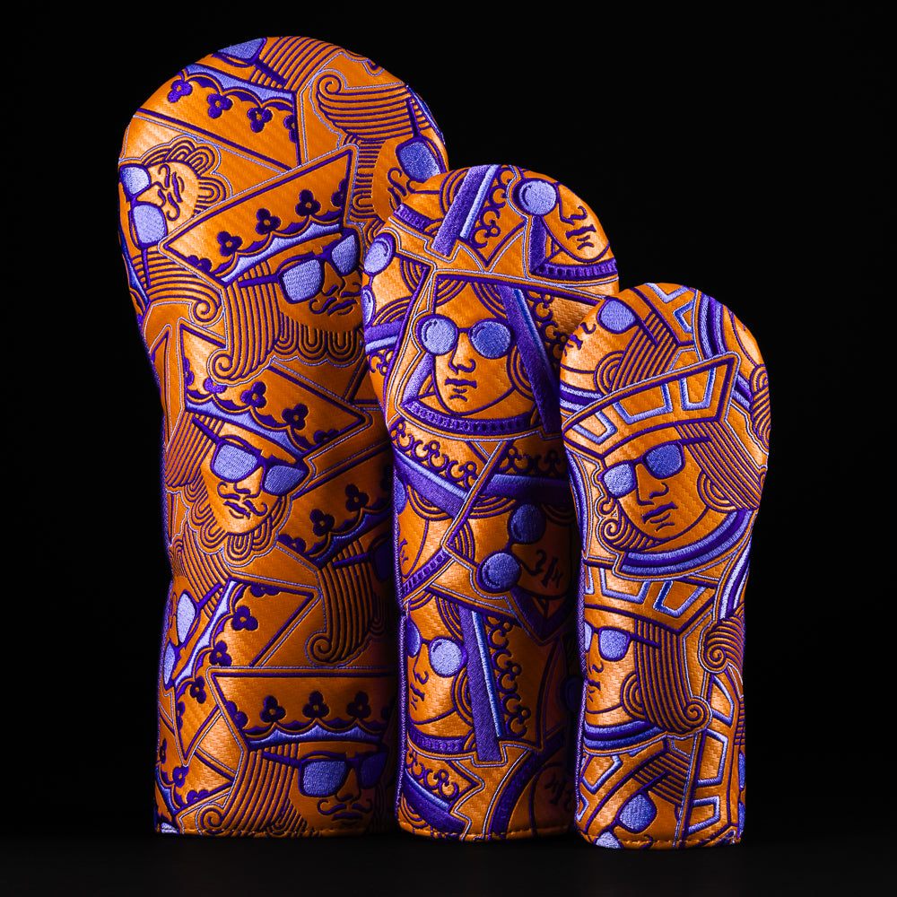 Swag stacked royalty headcover set of king, queen, and jack in an orange and purple colorway.