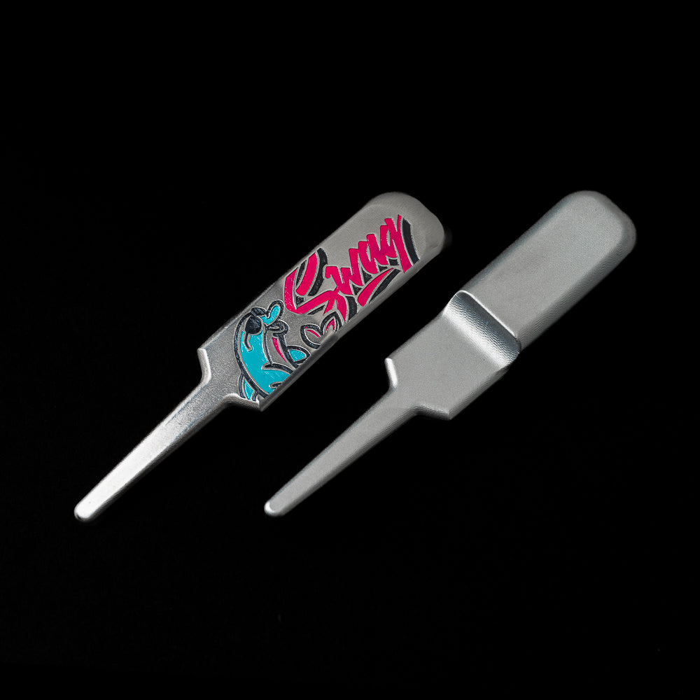 SWAG Golf Vice Beach flipper stainless steel golf divot tool with neon pink and blue.