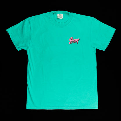 SWAG Golf x Comfort colors men's green short sleeve graphic t-shirt featuring flipper in Vice Beach setting.