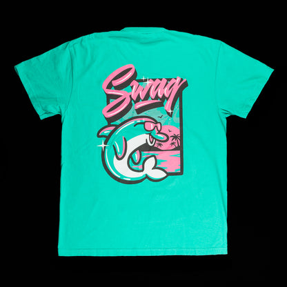 SWAG Golf x Comfort colors men's green short sleeve graphic t-shirt featuring flipper in Vice Beach setting.