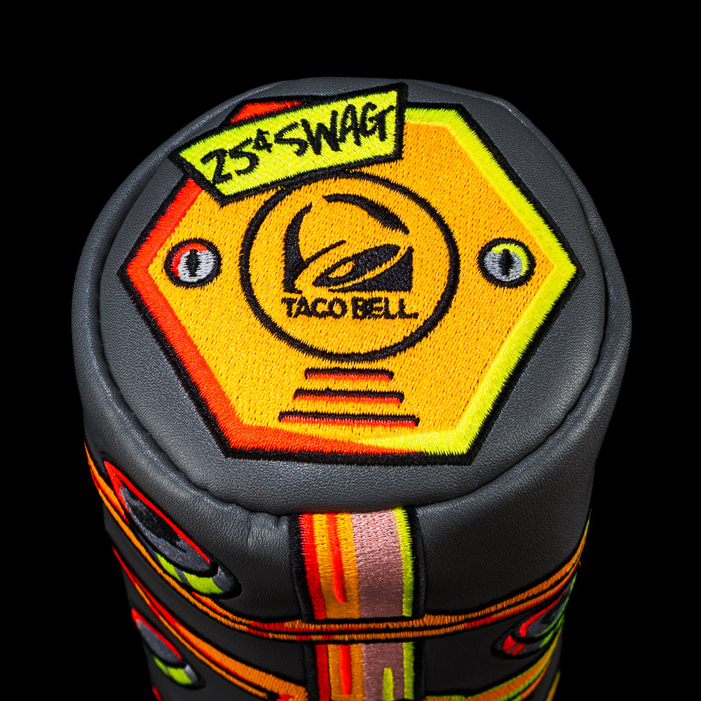 Top of the Taco Bell Coin Game barrel fairway cover, showing an orange hexagon patch with the Taco Bell logo and 25 cent SWAG typography. 