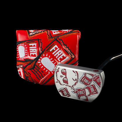 Taco Bell x SWAG Golf Fire Sauce BOSS 2.0 putter beside its red Fire packet cover.