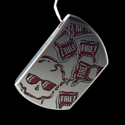 Close-up of red Fire Sauce packet graphics and skull across the silver BOSS 2.0 putter head.