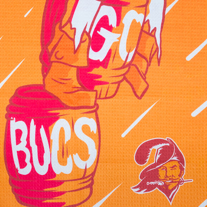 Orange golf towel with NFL Tampa Bay Buccaneers mascot character and 'GO BUCS' text on a black background.