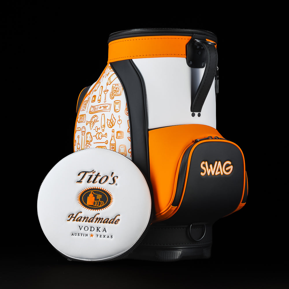 SWAG Golf Tito's Den Caddy Cooler featuring white, orange, and black Tito's Handmade Vodka artwork with a detachable lid.