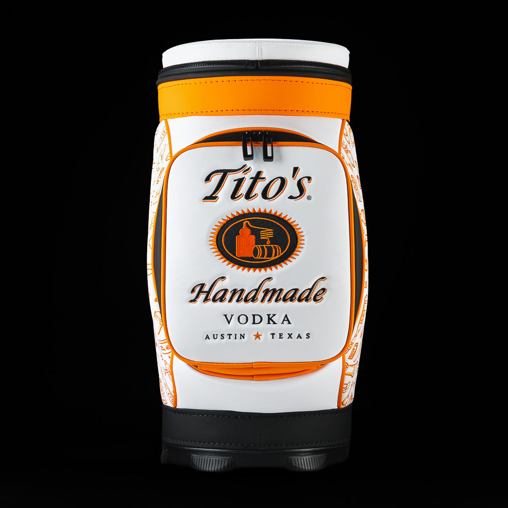 Front view of the SWAG Golf Tito's Den Caddy Cooler featuring Tito's Handmade Vodka branding and orange trim.