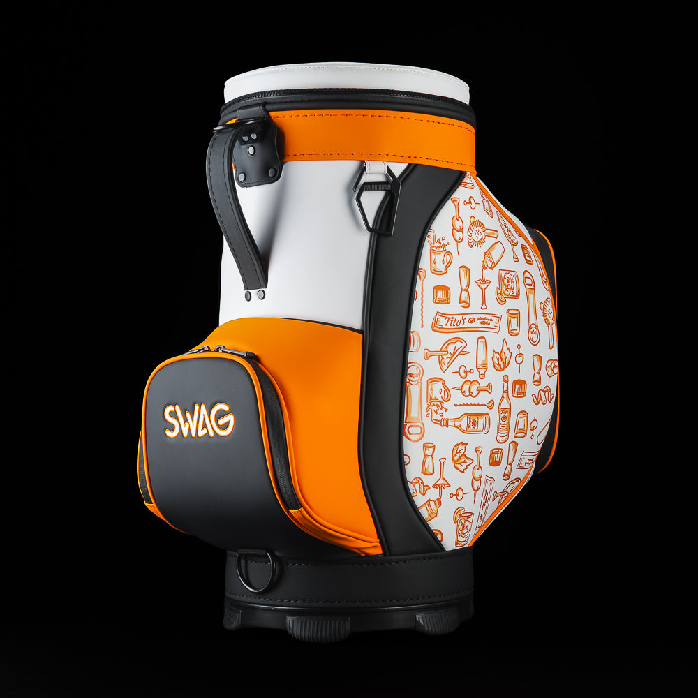 Angled rear view of the SWAG Golf Tito's Den Caddy Cooler showing the carry handle, removable lid, and side graphics.